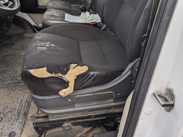 Torn driver seat without a protective cover